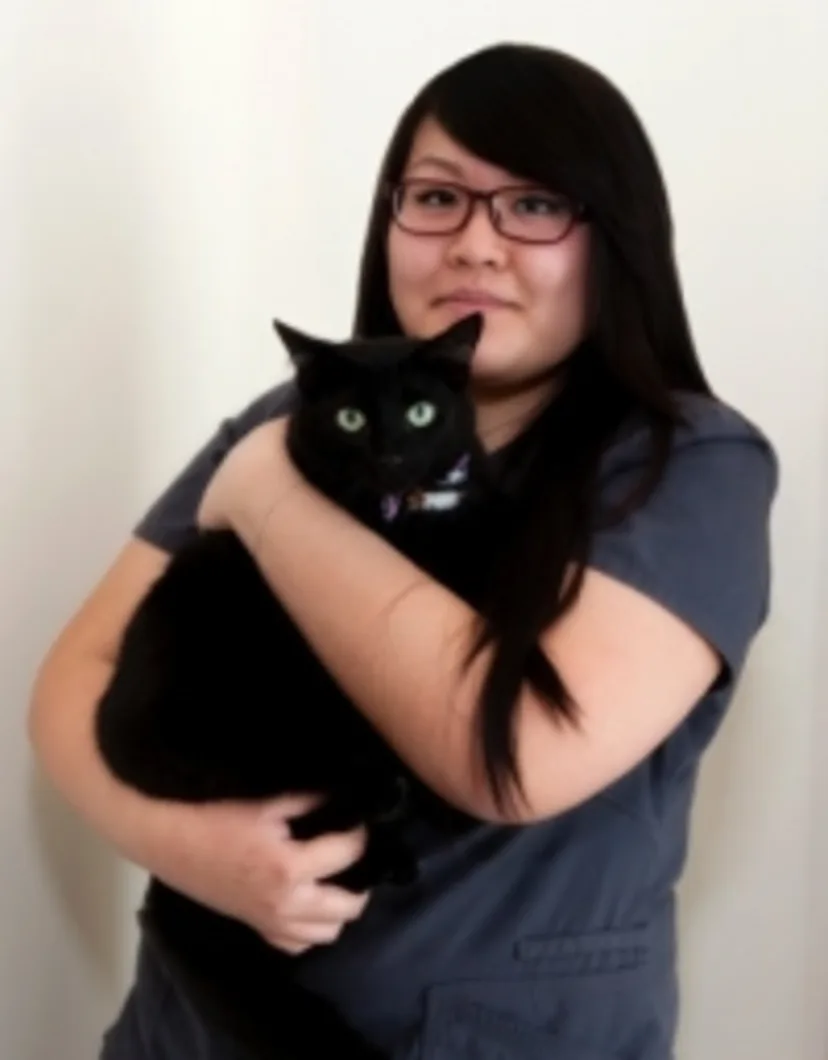 Annie Holding a Black Cat